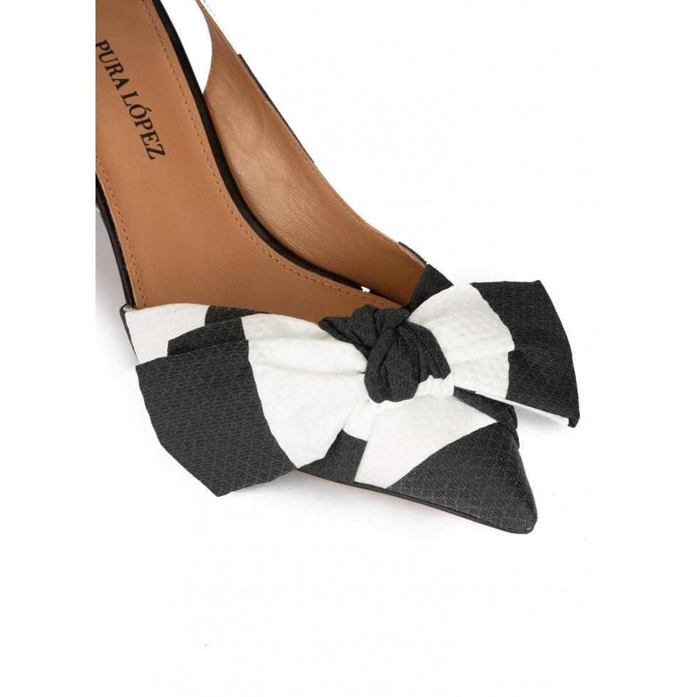 pura lópez Zapatos de punta fina y tacón medio en blanco y negro con lazo Precios de Black Friday
