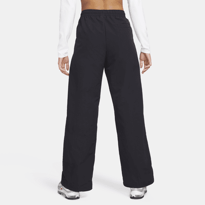 Nike Nike Sportswear Everything WovensPantalón de talle medio con dobladillo abierto - Mujer COMPRAR AHORA