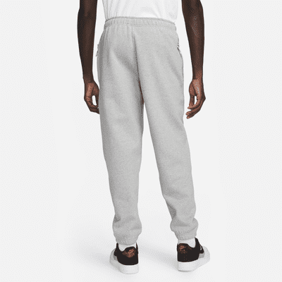 Nike Nike Solo SwooshPantalón de tejido Fleece - Hombre Tienda de fábrica